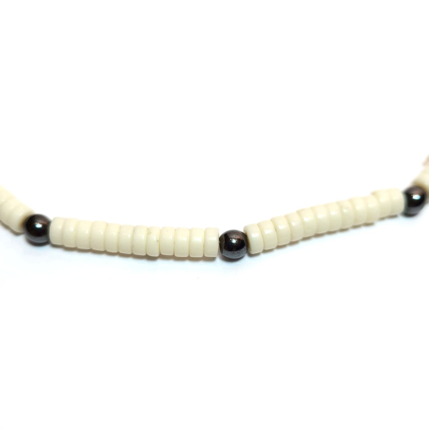 Close up of Ivory color heishi beads with hematite beads necklace
