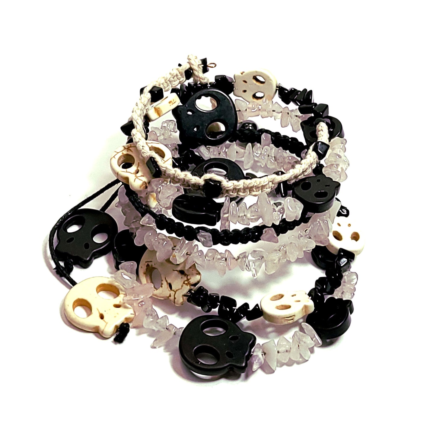 memory wire bracelet made with bone and black color skull beads, black and white beads, black and bone color macrame cord, rose quartz chip beads.