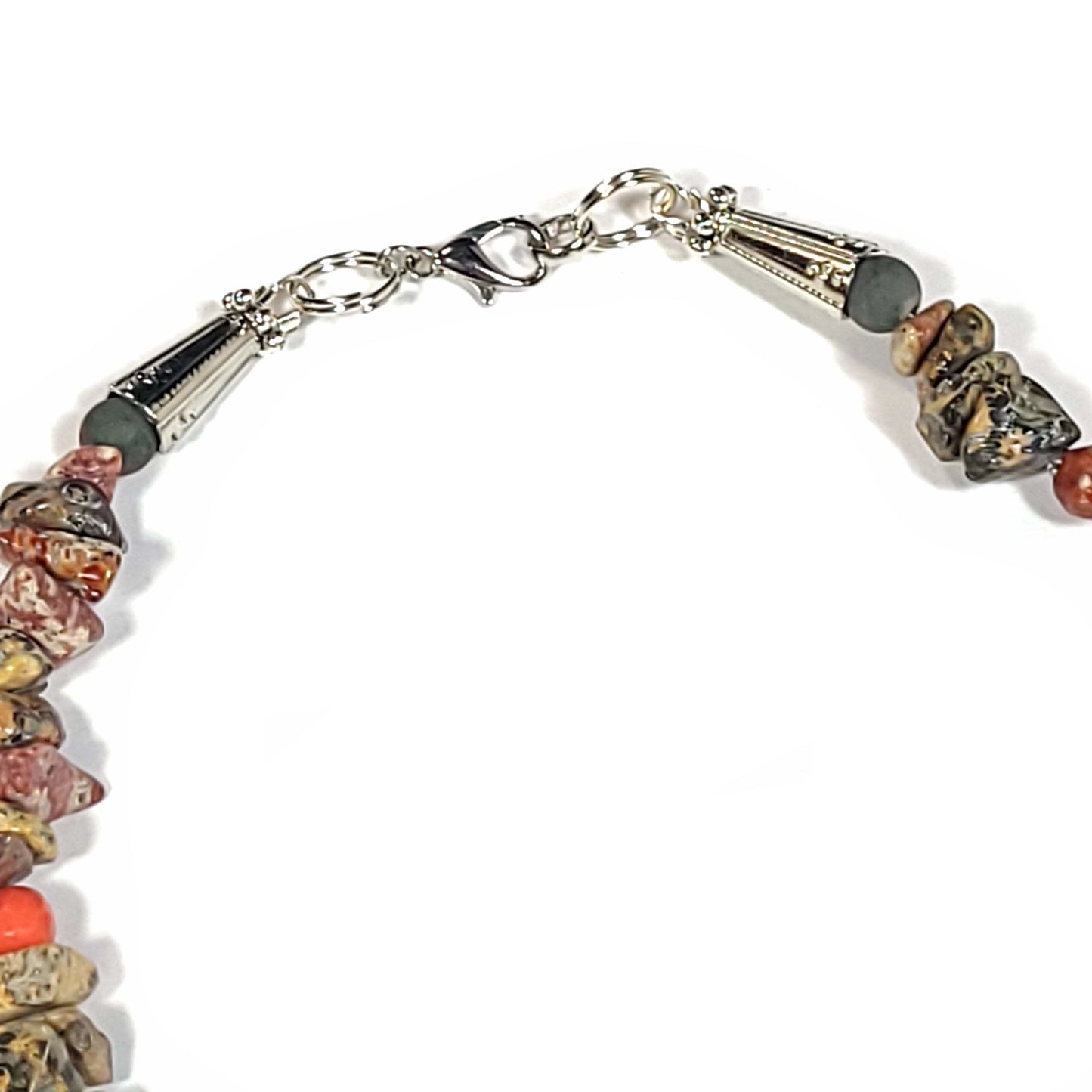 Necklace made with mixed earth color Jasper with Rhodonite beads. Silver toned end caps with lobster claw clasp. Clasp view.