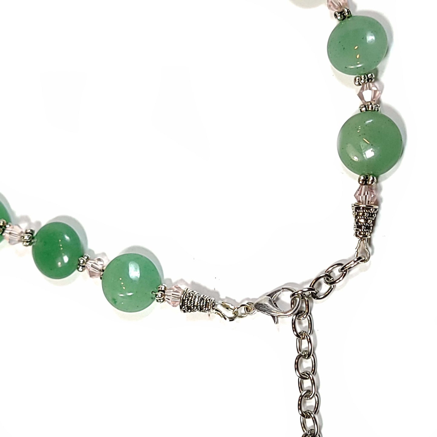 Aventurine disc beads with pale pink bicoone beads and silver tone spacers necklace. Clasp view.