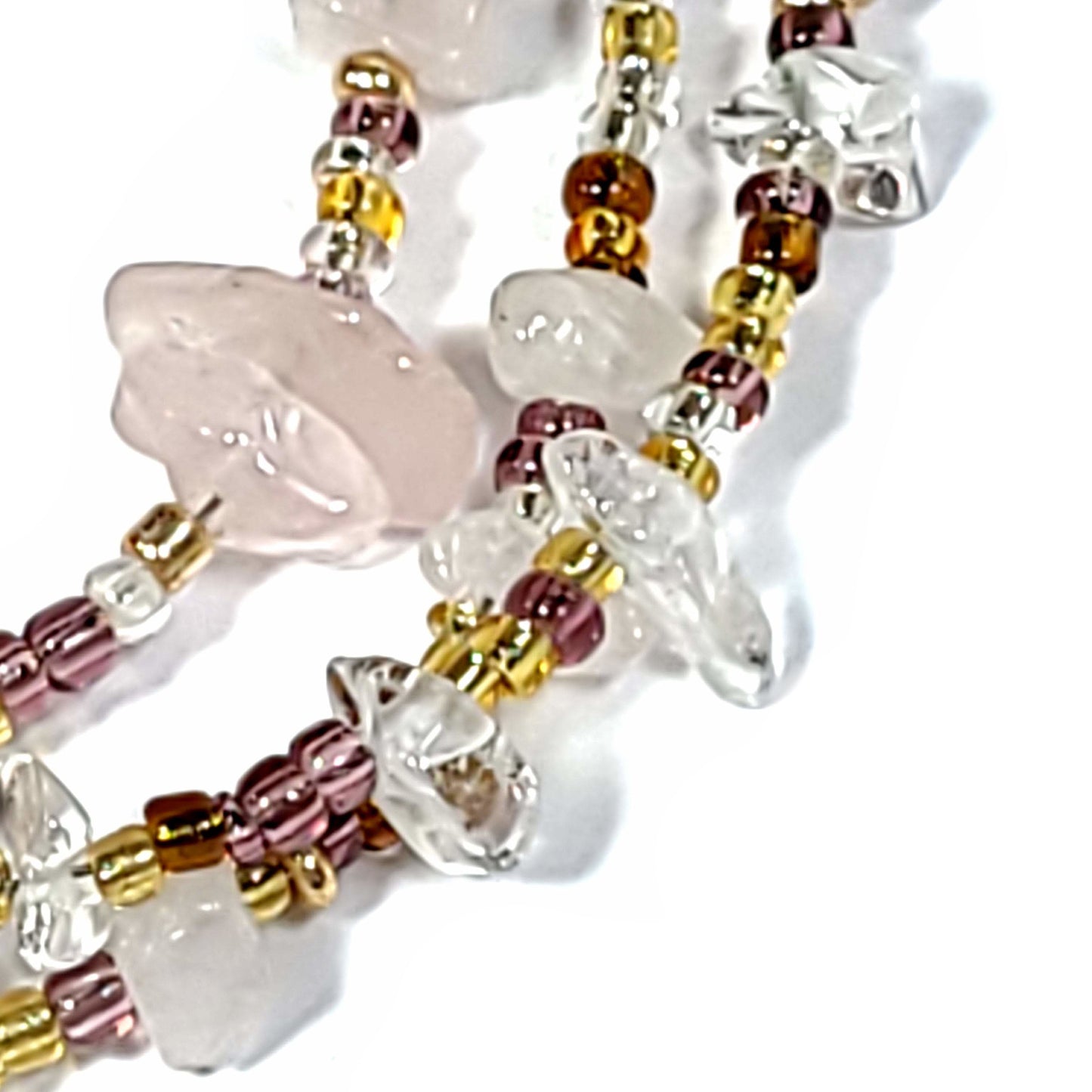 Close up view of Bracelet with 3 strands of Rose Quartz chips and Multi Gold Seed beads with a toggle clasp.