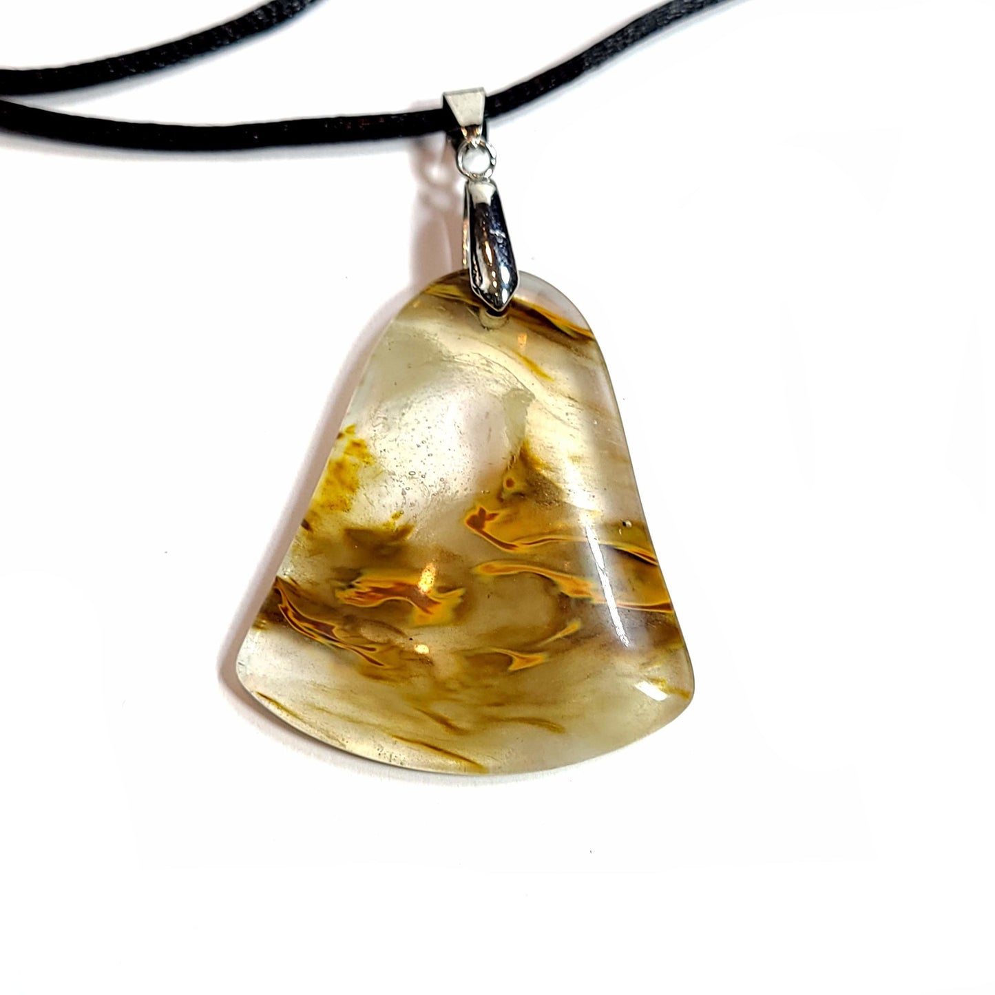 Quartz pendant with interesting occlusions. Comes with a black satin cord with an adjustable slip knot.