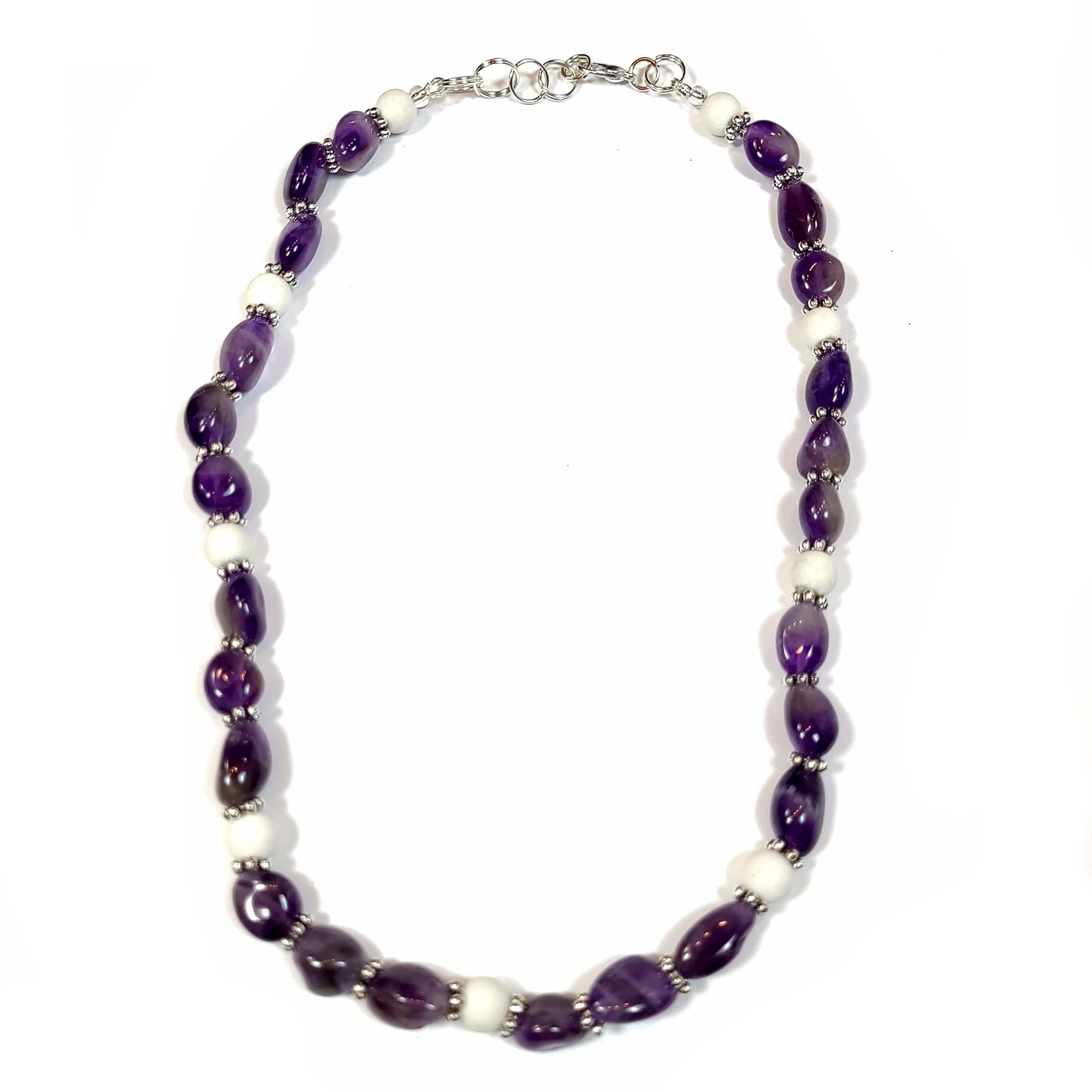 Necklace made of amethyst pebble beads and white quartz beads with a silver color lobster clasp.