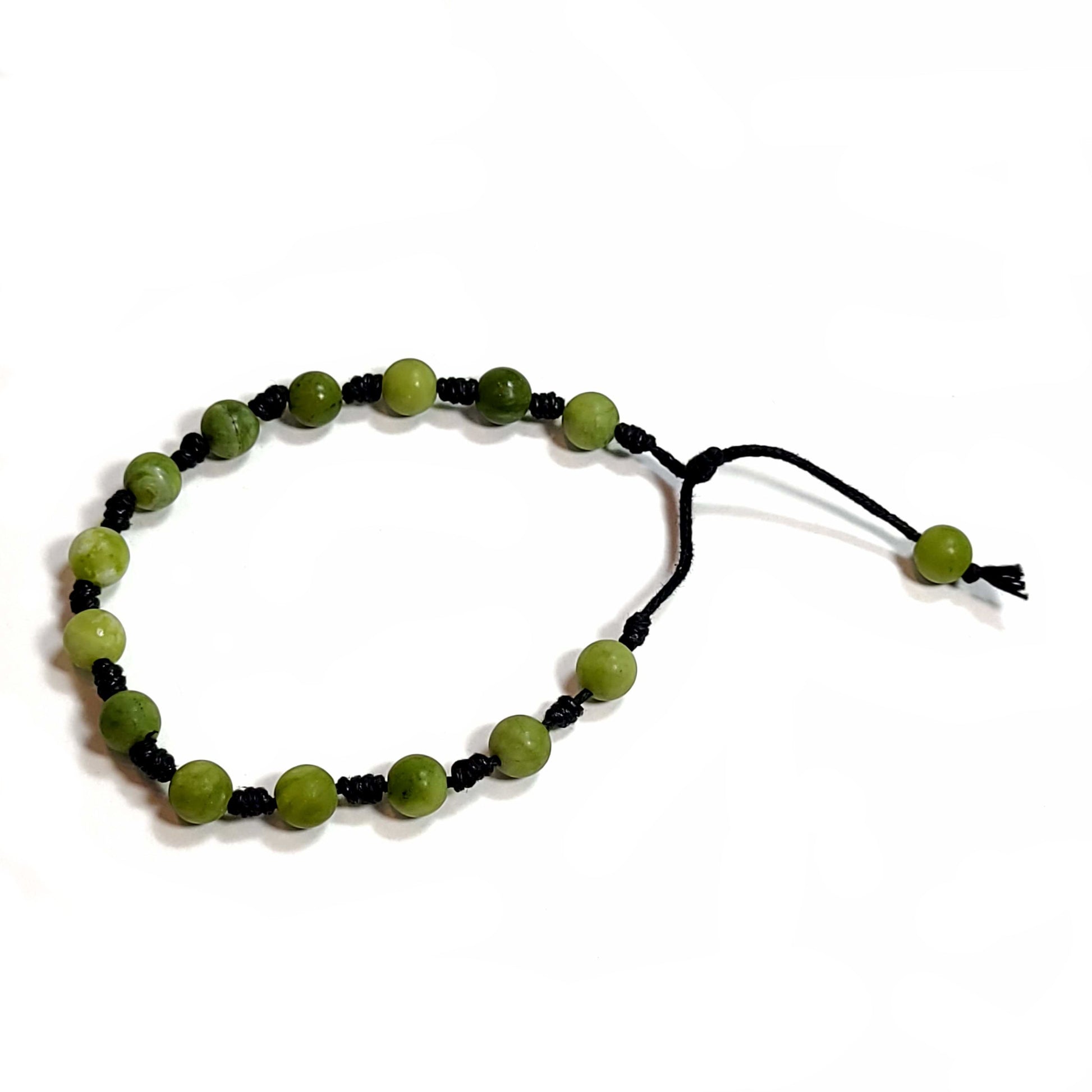 Handmade, hand knotted black cord, medium green matte finish aventurine beaded bracelet. Adjustable slip knot with one pull cord for adjusting the fit.