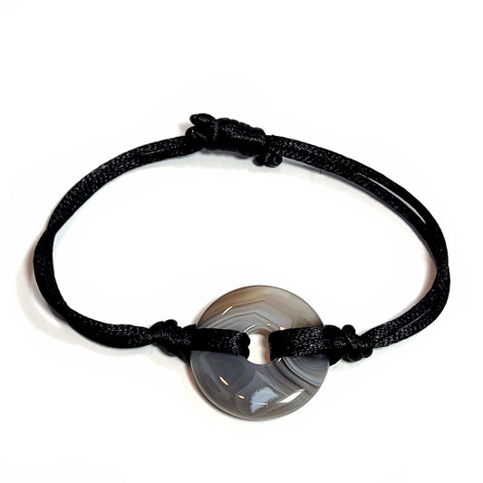 Grey agate doughnut stone with satin cord bracelet