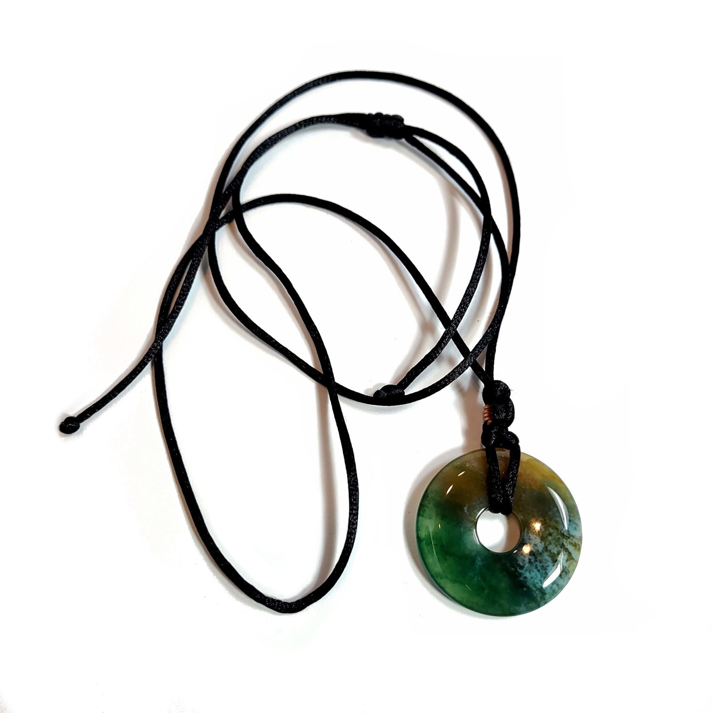 Doughnut shaped agate stone on a satiny black cord necklace