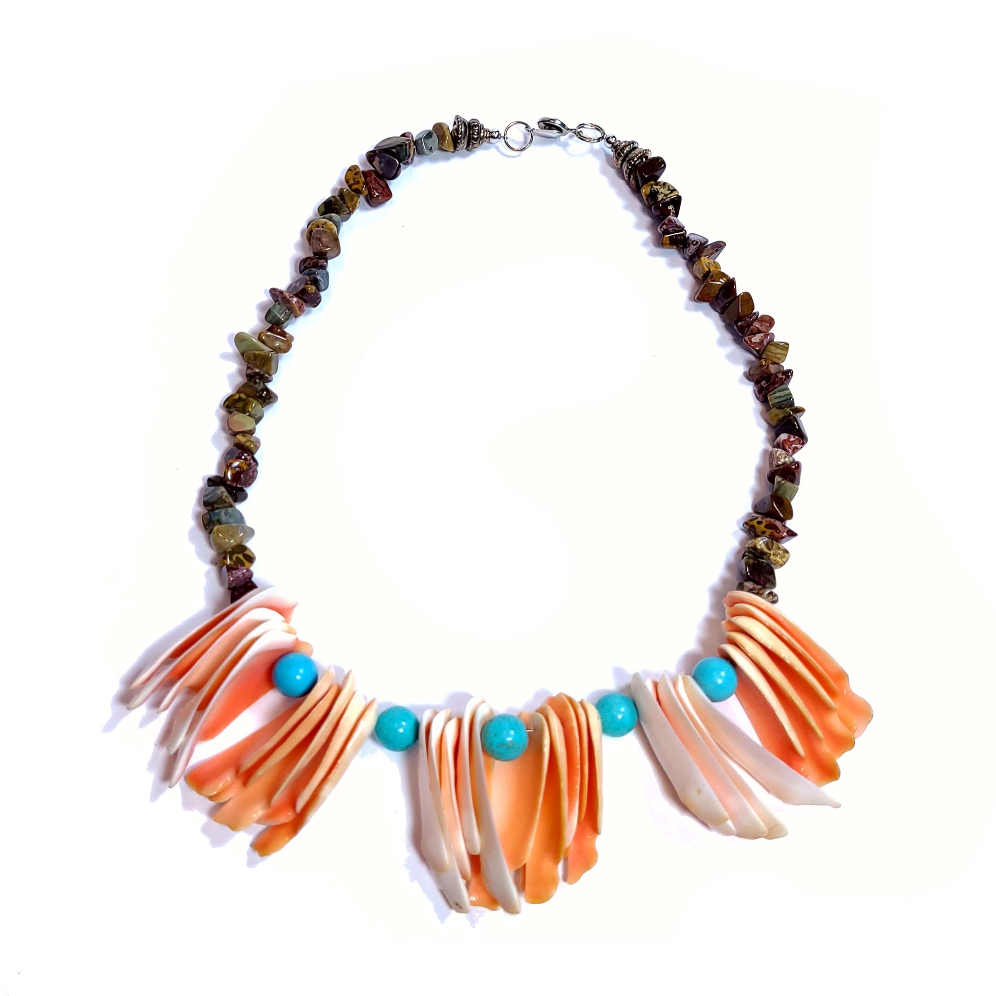 Handcrafted necklace with vintage shells, jasper chip beads, and 5 10mm turquoise dyed beads.