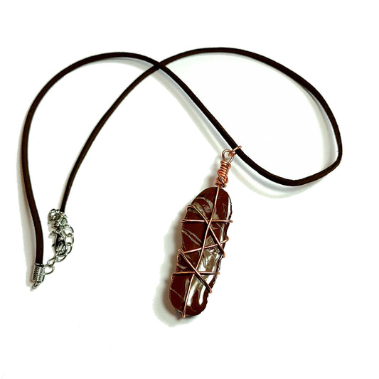 Red jasper with white stripes, stone coated in resin, wrapped with copper wire on a leather necklace with a 2 inch extender. 