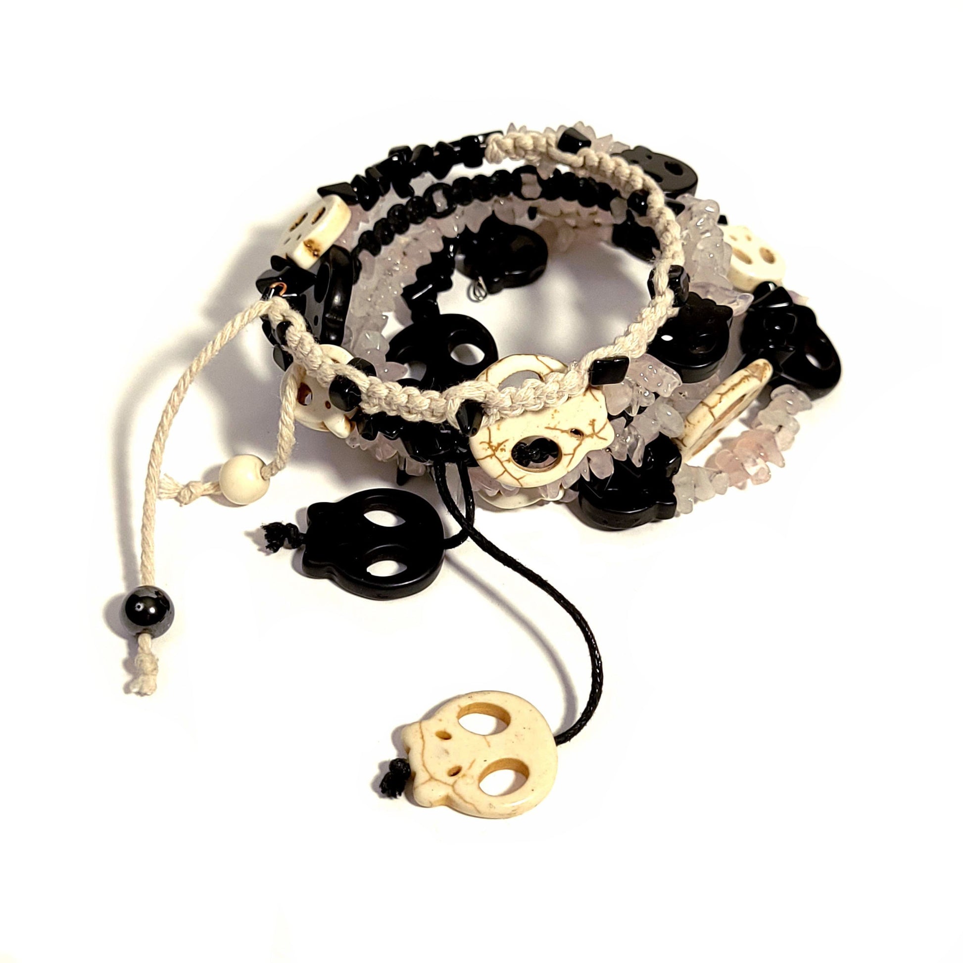 memory wire bracelet made with bone and black color skull beads, black and white beads, black and bone color macrame cord, rose quartz chip beads.