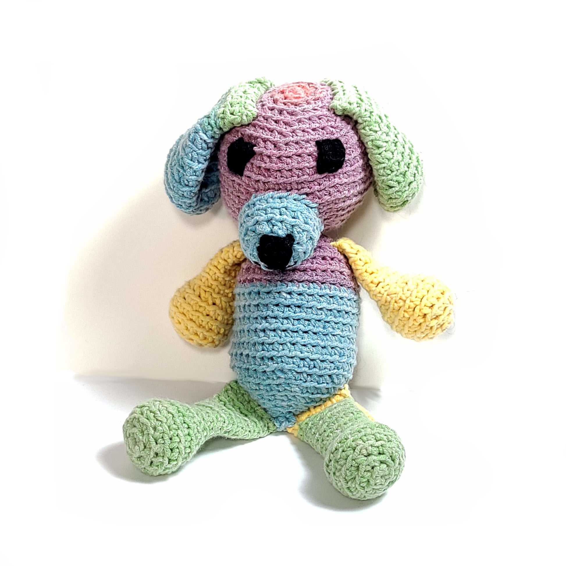 Multi-color hand crocheted puppy stuffie. Yellow, green, blue, lavender.